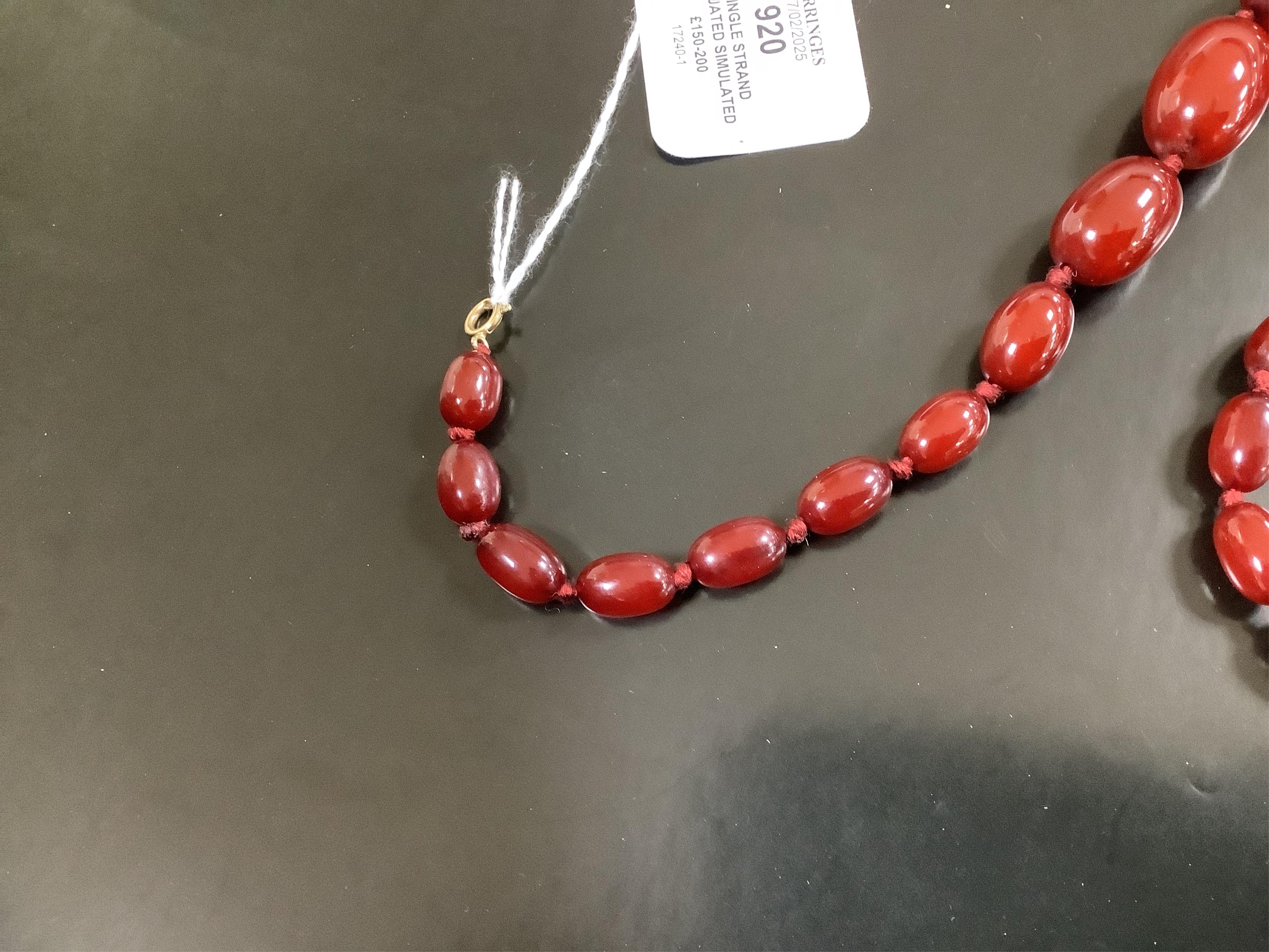 A single strand graduated simulated cherry amber necklace, 46cm, gross weight 58 grams. Condition - fair to good